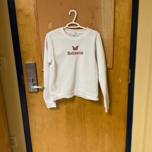 SheIn “antisocial” white crew neck sweater. size medium.